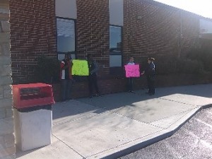 Some of those opposed to the closing of Eastanollee Elementary speak with BOE Member Dr. Elizabeth Pinkerton (far right) prior to Monday's hearing.